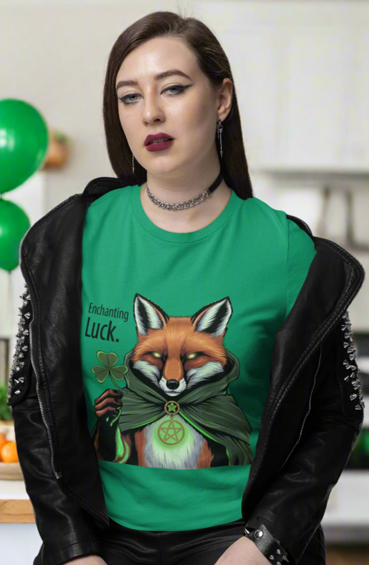 Girl standing in a pose wearing a Kelly green t-shirt with the Enchanted Luck Fox design, surrounded by St. Patty's Day balloons in the background. witchypets.com